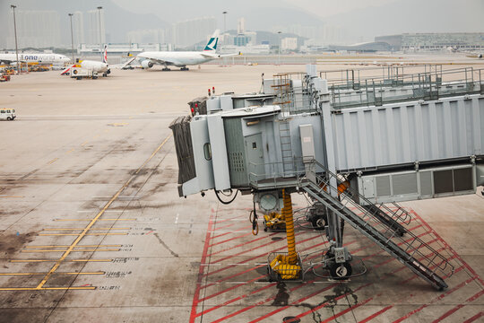 Jet bridge and parked aircraft at Hong Kong airport