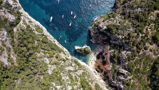 Aerial view of the beautiful and hidden  Cala En Cal&oacute;, and the anchorage in Cape La Nao, coast of the town of J&aacute;vea, Mediterranean Sea, Spain.