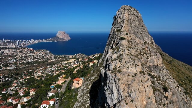 Aerial view of Morro de Toix mountain between Calpe Bay and Altea, a fantastic hiking area joint to the Mediterranean Sea, Spain. Drone view of the viewpoint over Calpe Bay, in Spain.