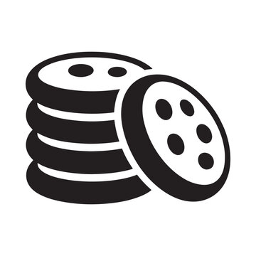 A stack of black and white cookies with a tilted top cookie