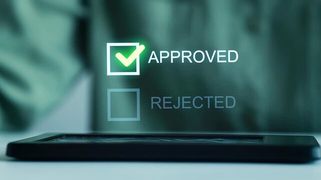Approval process display shows checkmark for approval and empty box for rejection on a tablet screen at work.