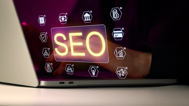 Hands using laptop displaying SEO and AI symbols at night in a digital workspace.