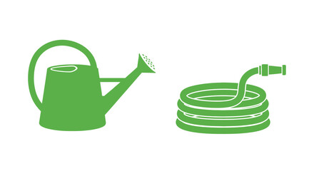 Obraz premium Green watering can and garden hose.