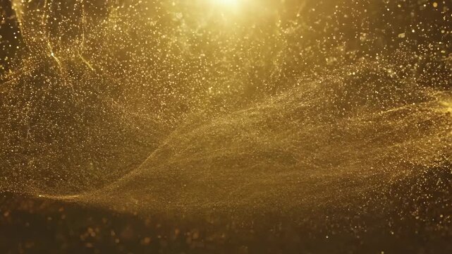 A gold background with a lot of sparkles. The gold color is prominent throughout the scene, creating a warm and luxurious atmosphere. The sparkles are scattered all over the background