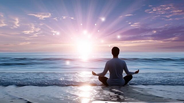 Person meditating on beach at sunrise with glowing light over ocean creating peaceful mindfulness and spiritual wellness concept