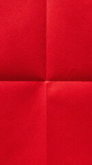 Fototapeta premium Vertical folded scarlet red sheet, paper textured background with copy space for social media design