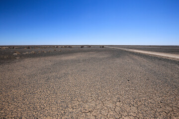 Naklejka premium Desolate flat area near Verneukpan where land speed records were performed, Northern Cape, South Africa