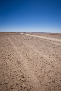 Sand road area cutting through the arid and barren Northern Cape landscape en route to Verneukpan