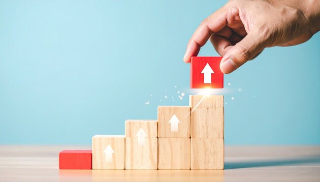 Hand placing red block staircase arrows growth progress