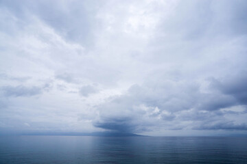 Obraz premium Storm Clouds Over Calm Sea Horizon Minimal Seascape