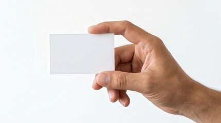Obraz premium Realistic Photo of Hand Holding Blank White Business Card in Minimalist Style