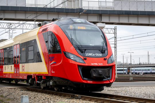Warsaw, Poland - April 04, 2026: A passenger train traveling on the tracks near the Warszawa Olszynka Grochowska station.