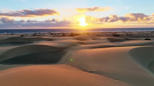 Drone flight towards sunrise over sand dunes of Maspalomas 60 fps, LUT