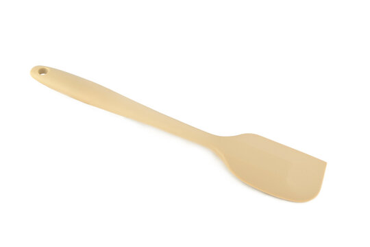 Beige silicone spatula for cooking and baking isolated on a white background.
