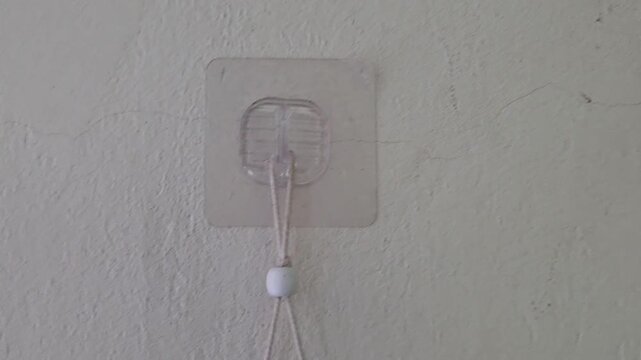 Adhesive wall hook holding simple home organization solution adhesive hook clear hook