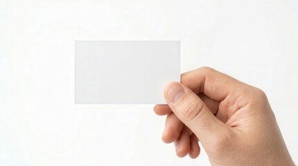 Fototapeta premium Hand Holding Blank Business Card Photo for Professional Identity and Networking