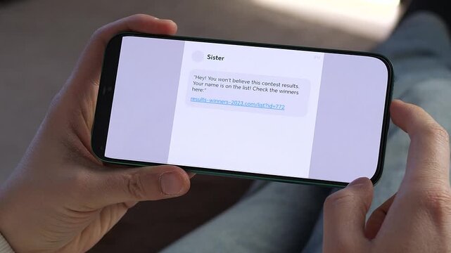 Person reading suspicious message with link on smartphone screen. Online scam, phishing attempt and cybersecurity awareness concept. Perfect footage for digital security campaigns, fraud prevention