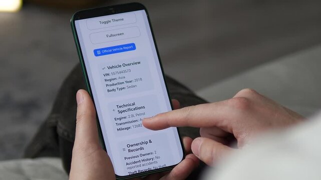 Close-up of modern UI displaying vehicle specs, ownership records, and risk scores. User scrolls through technical data. Ideal for automotive tech reviews, car dealership marketing, and fintech app