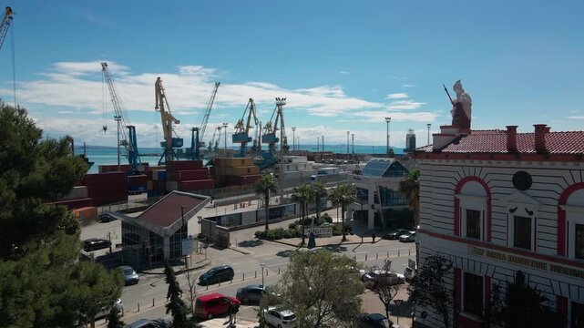 Aerial view of a 1930s architectural sculpture of a goddess on a ship prow, Port of Durres.