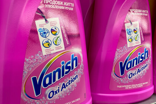 Kyiv, Ukraine, September 24, 2023: Pink bottles of vanish oxi action, a powerful household cleaning product for removing stains from laundry, on a shop shelf.