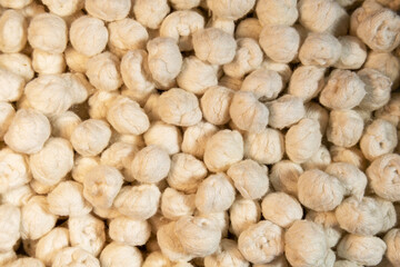 Fototapeta premium Natural silk cocoons texture closeup raw fiber organic material background