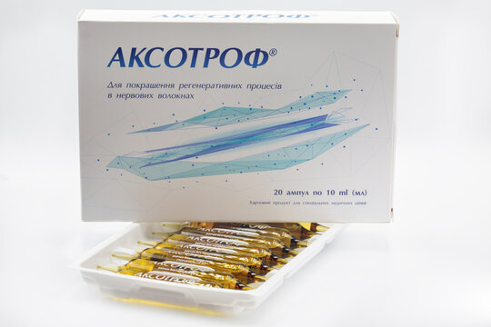 Aksotrof drinking ampoules, specialized medical nutrition product packaging closeup.