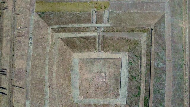 Top-down aerial drone view of small pyramid structure at Teotihuacan archaeological site, Mexico