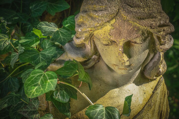 Fototapeta premium Peaceful angel statue in nature, symbol of calm, healing and emotional balance