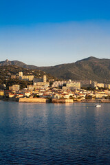 Fototapeta premium Ajaccio is the capital and largest city of Corsica island, a French commune, prefecture of the department of Corse-du-Sud. View of the city of Ajaccio and it port in the morning.