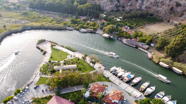 Aerial High Angle View of Dalyan River Canal and Town with Mountains and Boats in Mugla Turkey