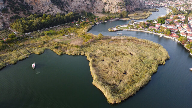 Aerial High Angle View of Dalyan River Canal and Town with Mountains and Boats in Mugla Turkey