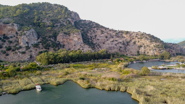 Aerial High Angle View of Dalyan River Canal and Town with Mountains and Boats in Mugla Turkey