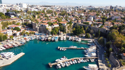 Naklejka premium Aerial High Angle View of Historic Kaleici Old Harbor with Yachts and Lighthouse in Antalya Turkey