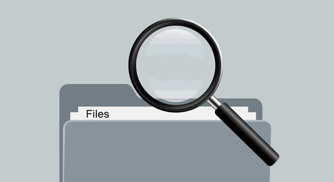 Magnifying Glass on File Folder Closeup.