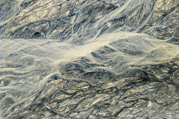 Fototapeta premium Scenic Bird's eye top-down view Aerial Drone Picture of the vulcanic Bucao River in Botolan Zambales in the Philippines