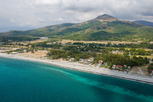 Scenic Panorama Aerial Drone Picture of the crystal clear water and the beach and Mount Katung-uhan in Botolan, Zambales in the Philippines 