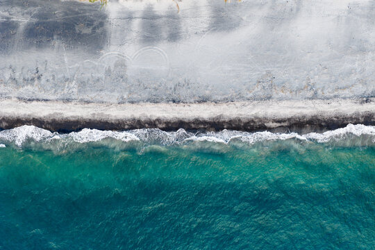 Scenic bird's eye top down view of the crystal clear water and the beach and in Botolan, Zambales in the Philippines 