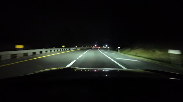 Driving on Highway at Night With Bright Road Lights