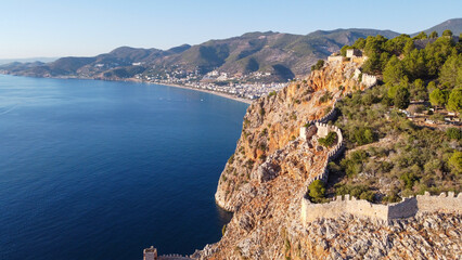 Naklejka premium Aerial Panoramic View of Historic Alanya Castle Walls with Kleopatra Beach and City Skyline in Antalya Turkey