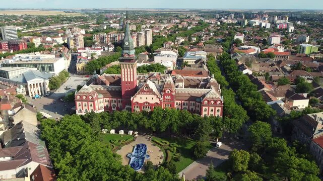 A drone slowly rotates to reveal monumental Art Nouveau facades in central Subotica, Serbia.