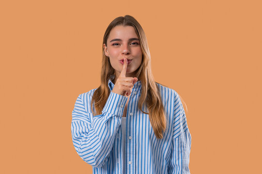 Pretty Woman Makes Shush Shh Gesture With Finger On Lips, Silence Signaling