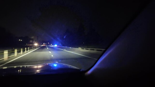 Driving Towards Flashing Lights of an Emergency Vehicle at Night