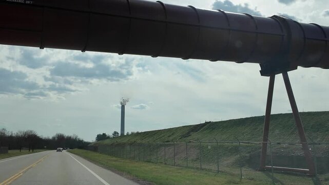 Driving Under a Pipeline on a Cloudy Day in an Industrial Area
