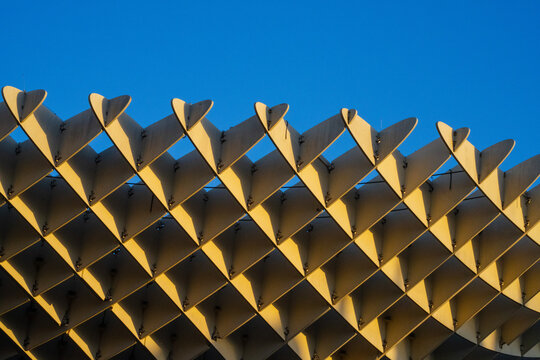 parametric grid minimal architecture abstract blue sky summer sunlight sustainable wood curve design detail closeup - Metropol Parasol (Setas de Sevilla, Las Setas) - Seville, Andalusia, Spain - 2025