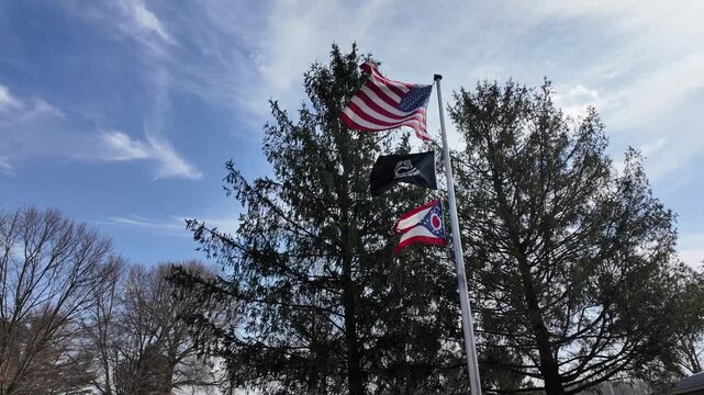 Flags of the USA and Ohio State Wave in the Wind With POW MIA Flag