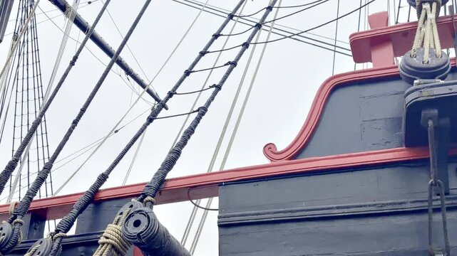 View of the cannons aboard Etoile du Roy, a 1745 corsair frigate replica in Saint Malo, Brittany, France, showing naval artillery in a historic maritime warfare setting