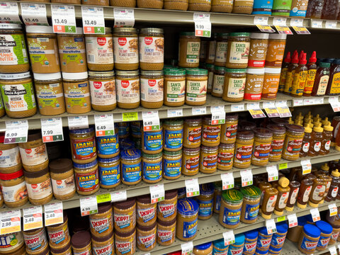 Peanut Butter And Nut Butter Jars Display On Grocery Store Shelf