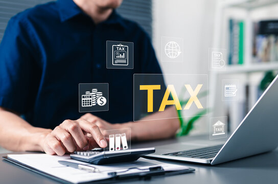 Tax payment concept with businessman using calculator and laptop. Professional male accountant calculating financial data with digital icons for individual income tax return and corporate accounting.