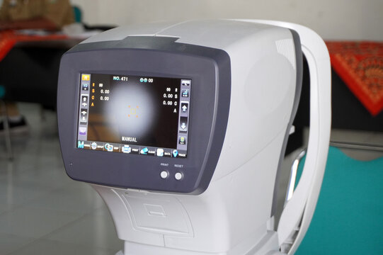 Close up of an autorefractor machine screen in an optical clinic. Professional ophthalmic equipment for eye examination and vision testing. Modern medical technology for healthcare concept.