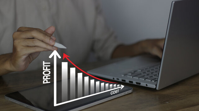 Profit and cost analysis concept showing a professional using a tablet to track financial growth and cost reduction strategies for business success and data-driven ROI optimization